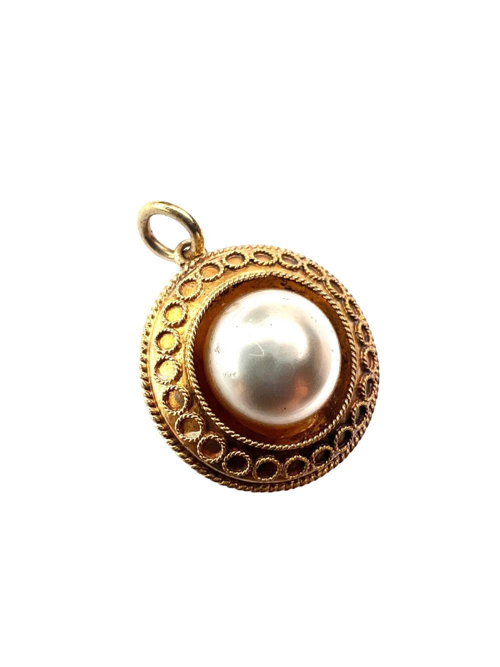 A circular Victorian yellow gold pendant featuring a large central pearl bordered by intricate filigree wirework and ropework detail. View II