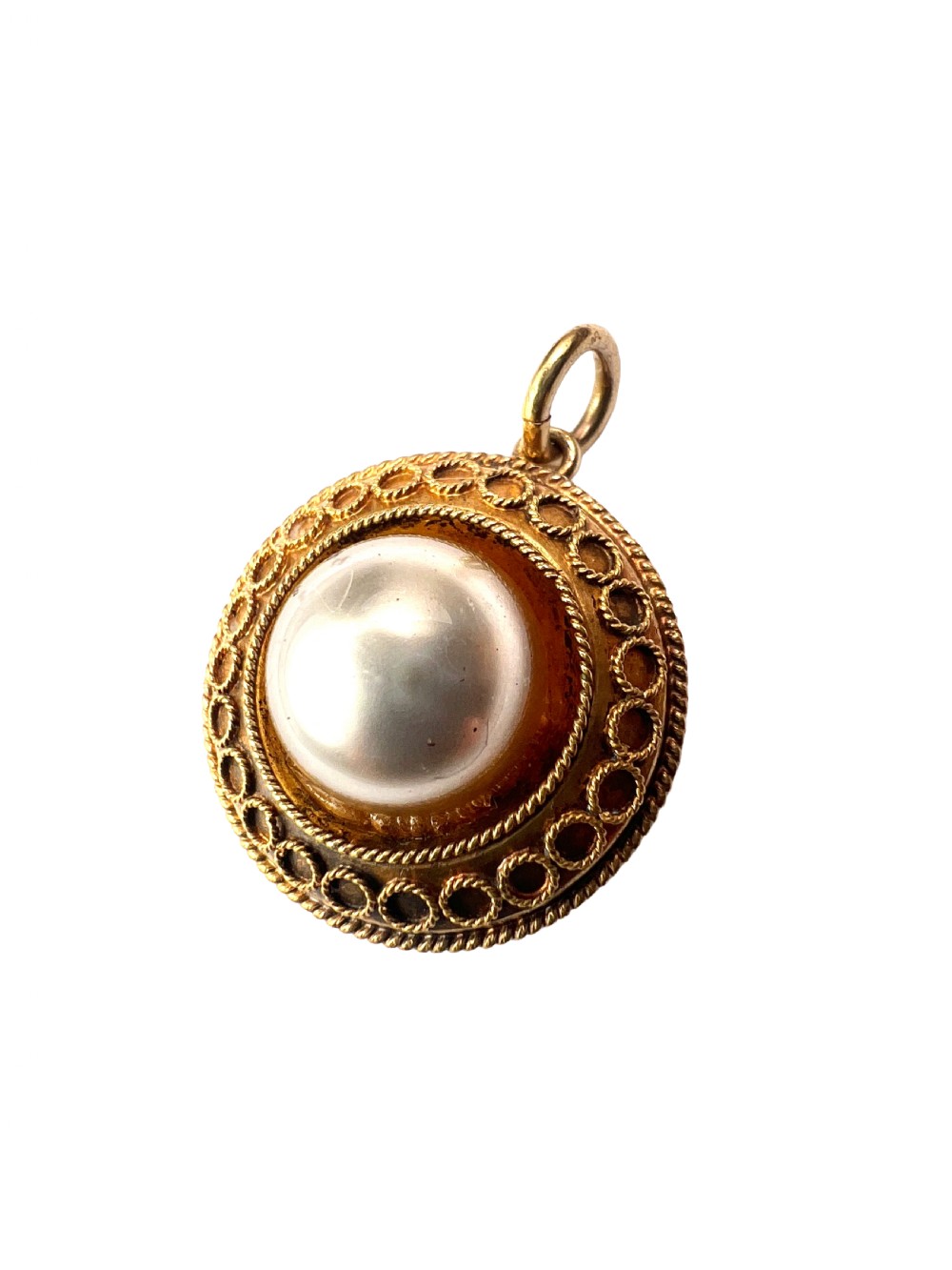 A circular Victorian yellow gold pendant featuring a large central pearl bordered by intricate filigree wirework and ropework detail. View III