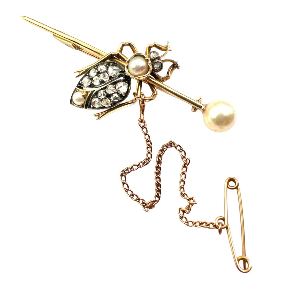 Victorian gold beetle brooch set with pave diamonds on the wing cases and pearls on the body and pin, fitted with a safety chain.