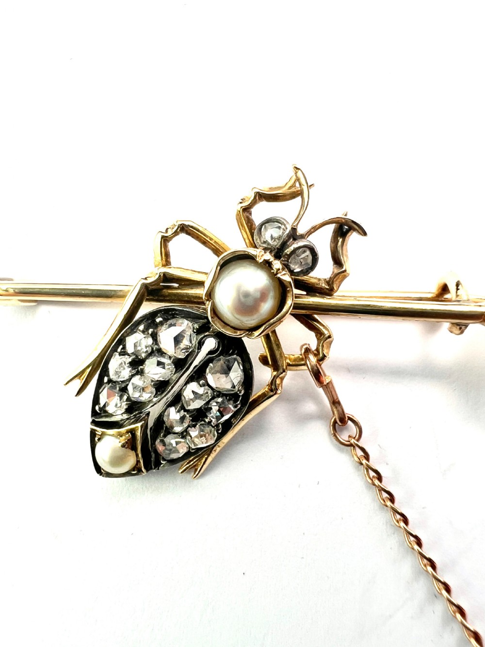 Victorian gold beetle brooch set with pave diamonds on the wing cases and pearls on the body and pin, fitted with a safety chain. View III