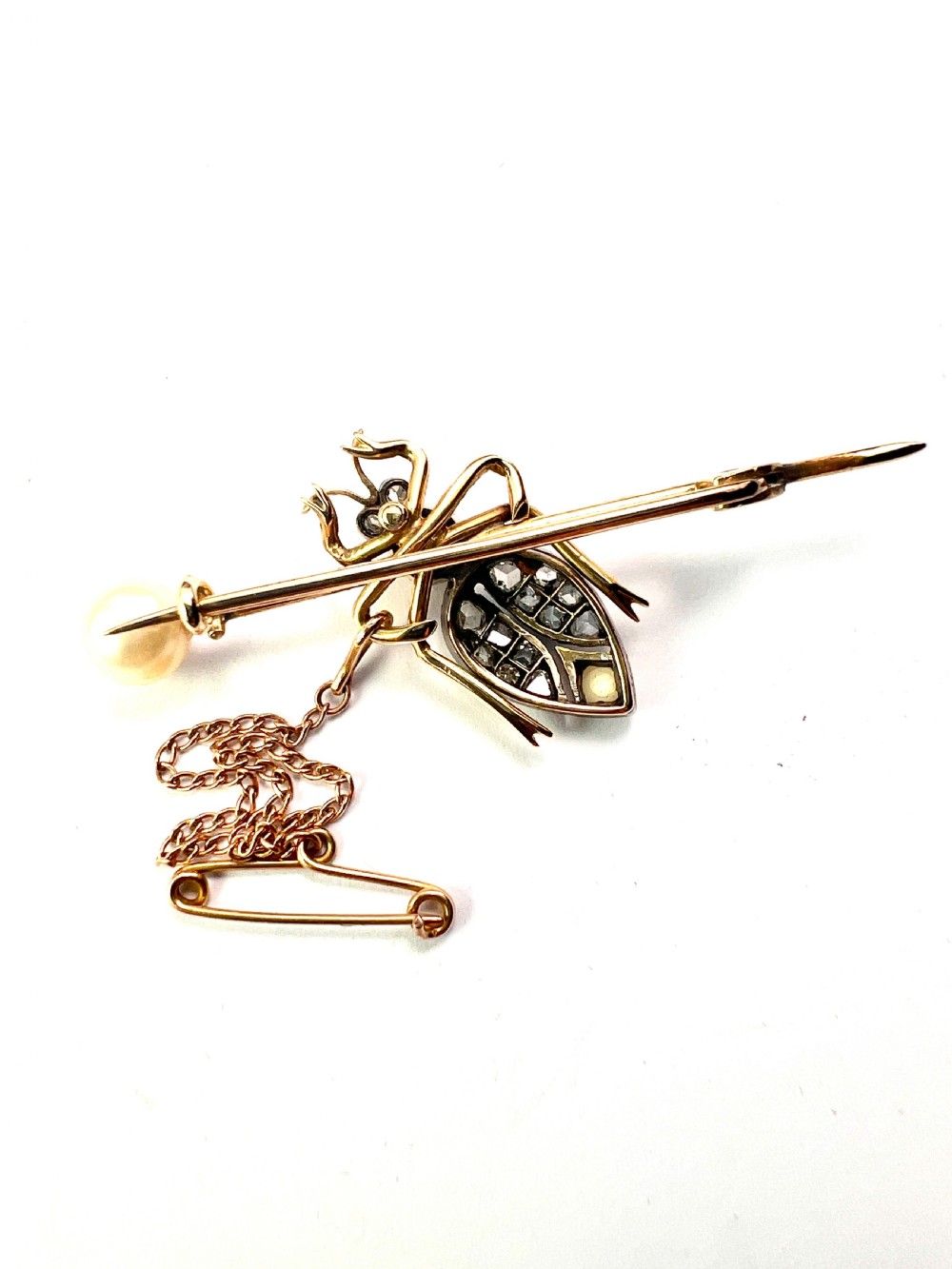 Victorian gold beetle brooch set with pave diamonds on the wing cases and pearls on the body and pin, fitted with a safety chain. View IV