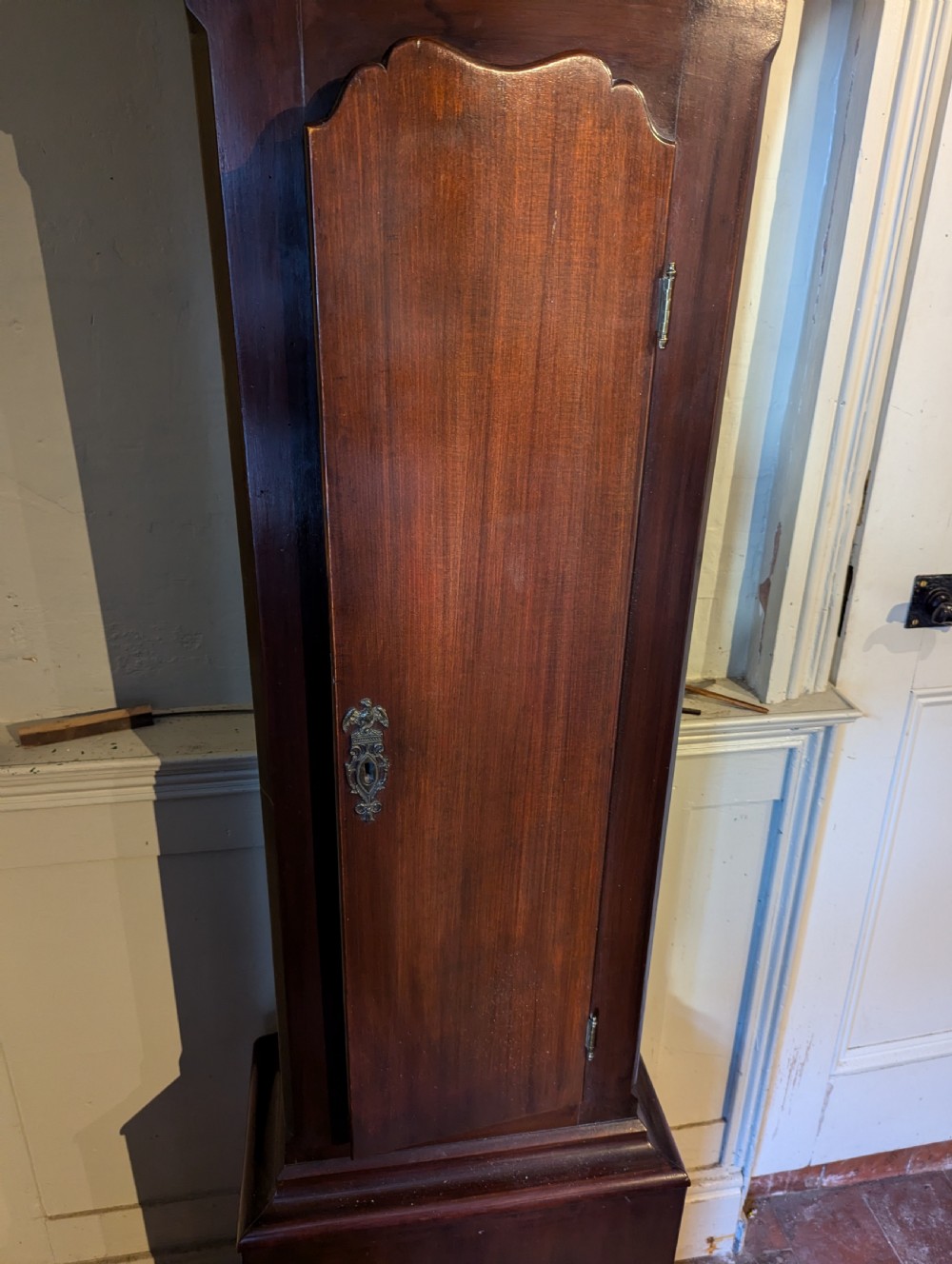 An 18th-century mahogany regulator longcase clock featuring an architectural pediment hood, circular brass dial signed Macpherson Edinb, and fluted columns. View II