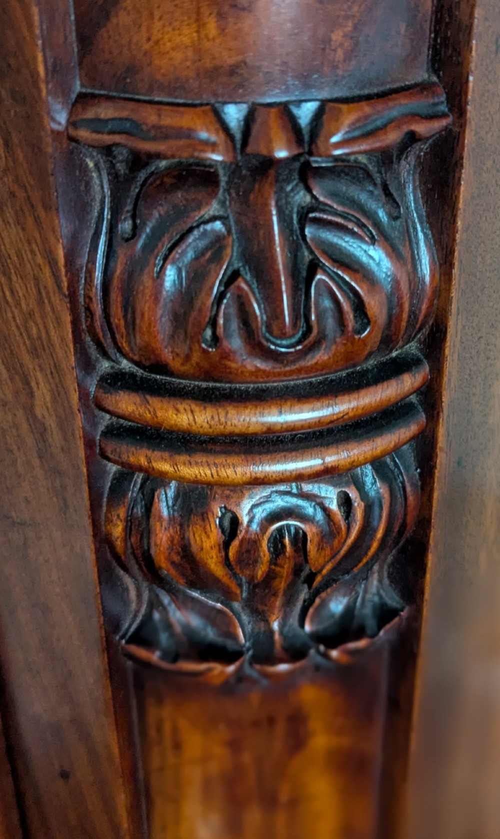 A 19th-century flame mahogany longcase regulator clock with an arched pediment, round silvered dial, and panelled wooden trunk. View VI