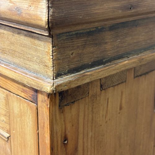 fig 3. A tall antique pine locker cabinet featuring fifteen panelled door compartments arranged in three columns with metal latches.