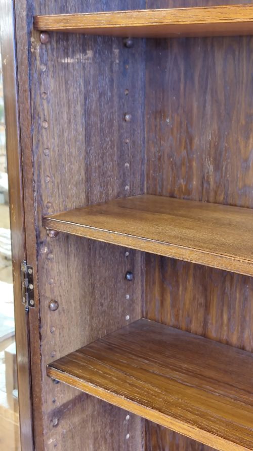EARLY 20TH CENTURY SOLID OAK GEOMETRIC ADJUSTABLE BOOKCASE ON CUPBOARD - ADDITIONAL PHOTO 1