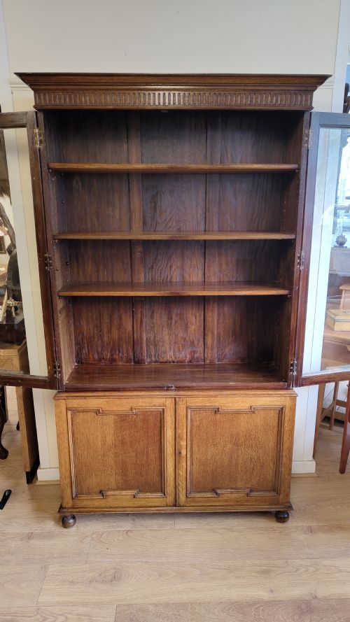 EARLY 20TH CENTURY SOLID OAK GEOMETRIC ADJUSTABLE BOOKCASE ON CUPBOARD - ADDITIONAL PHOTO 9