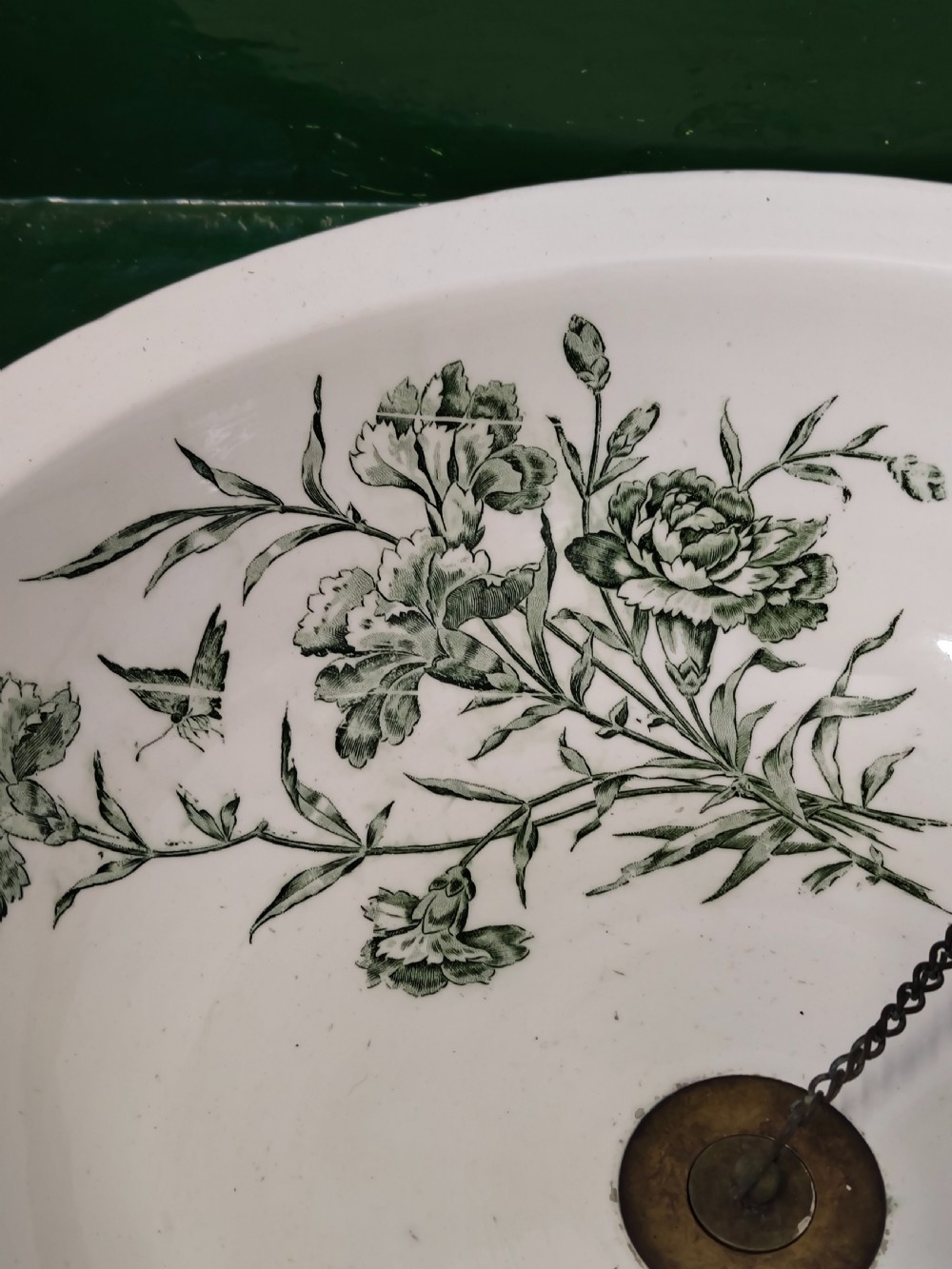 A hand-painted black and green metal toleware washstand with an open lid revealing a circular mirror and a fitted ceramic washbasin. View II