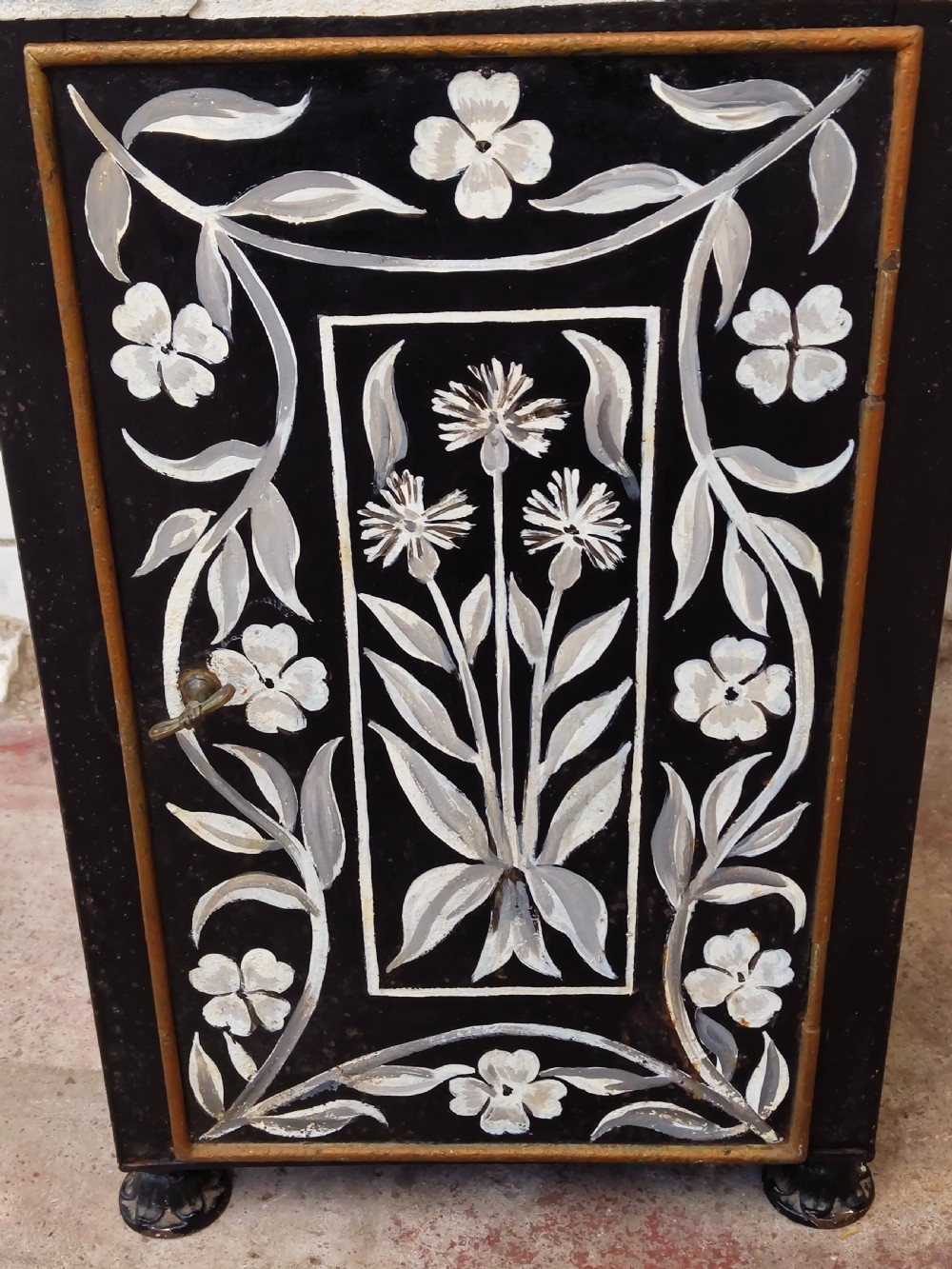 A hand-painted black and green metal toleware washstand with an open lid revealing a circular mirror and a fitted ceramic washbasin. View IX