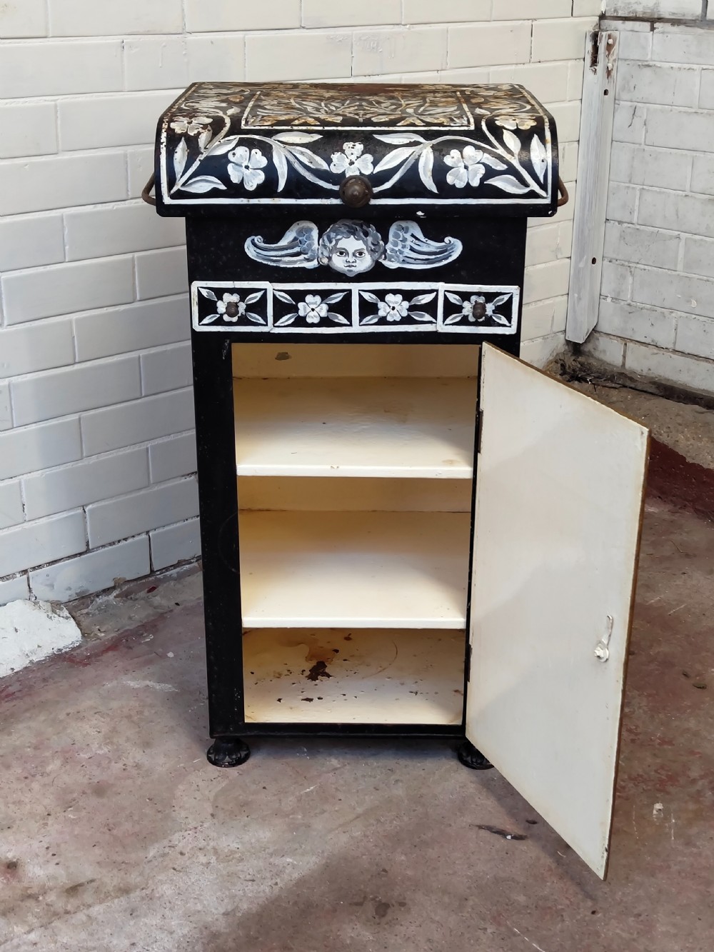 A hand-painted black and green metal toleware washstand with an open lid revealing a circular mirror and a fitted ceramic washbasin. View XX