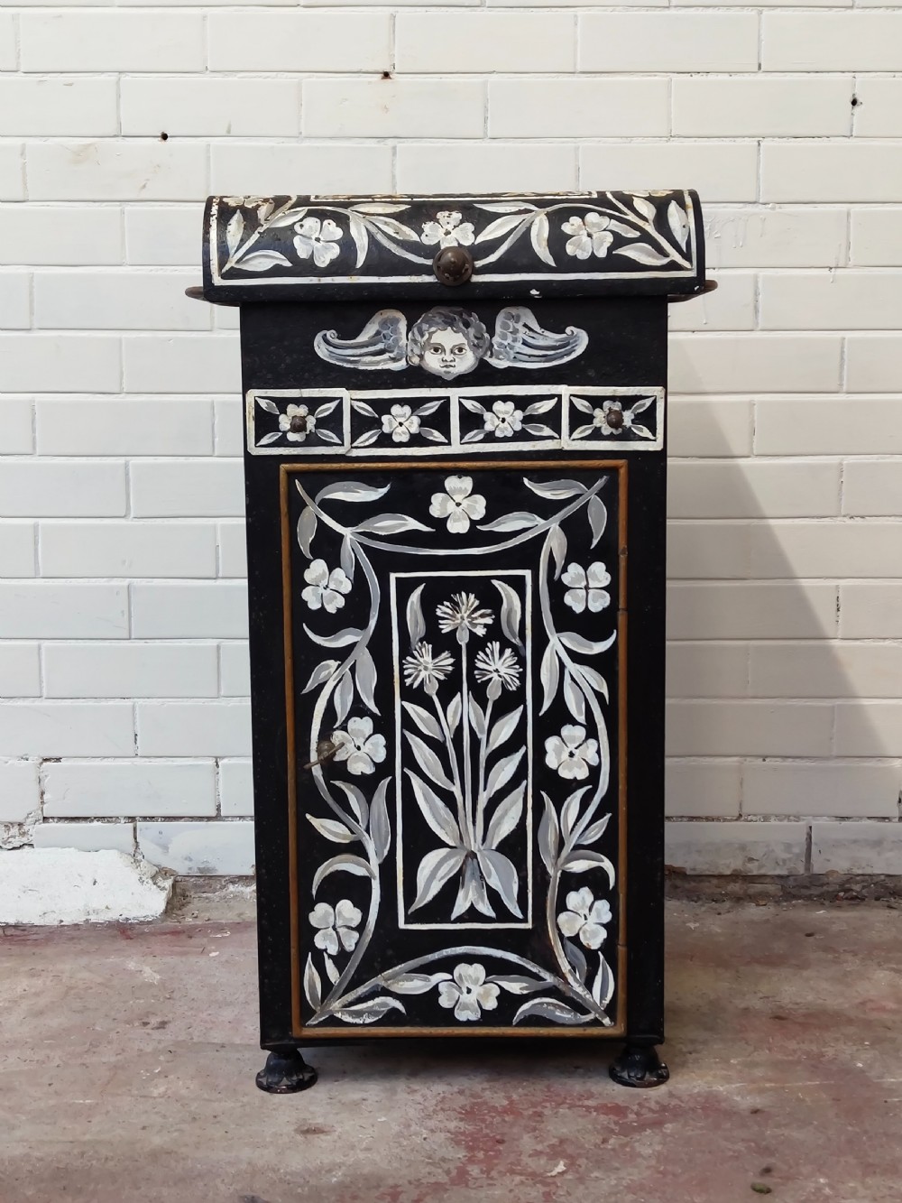 A hand-painted black and green metal toleware washstand with an open lid revealing a circular mirror and a fitted ceramic washbasin. View XXIV
