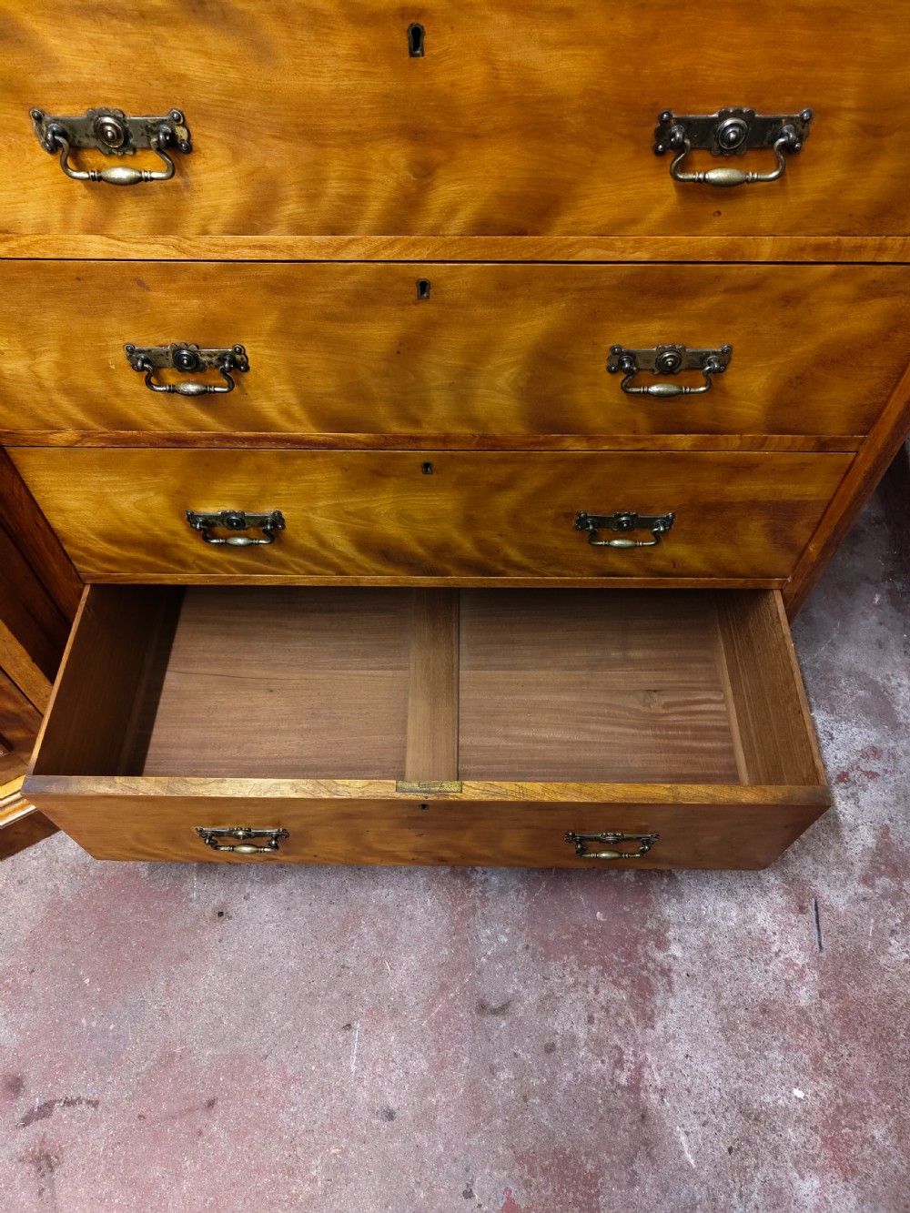 Victorian satin birch corner compactum wardrobe featuring arched panelled doors, brass hardware, and a integrated chest of drawers. View VII