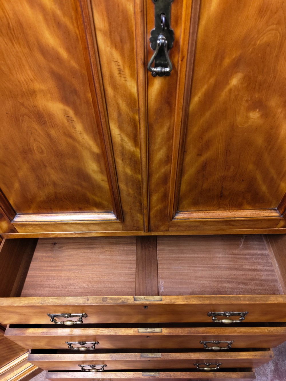 Victorian satin birch corner compactum wardrobe featuring arched panelled doors, brass hardware, and a integrated chest of drawers. View XIV