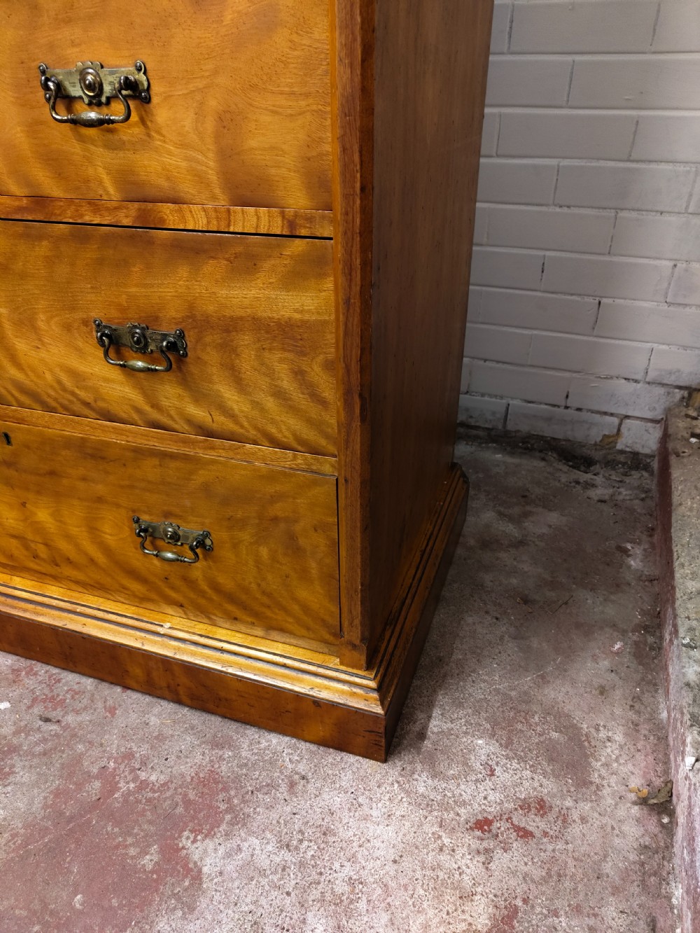 Victorian satin birch corner compactum wardrobe featuring arched panelled doors, brass hardware, and a integrated chest of drawers. View XV