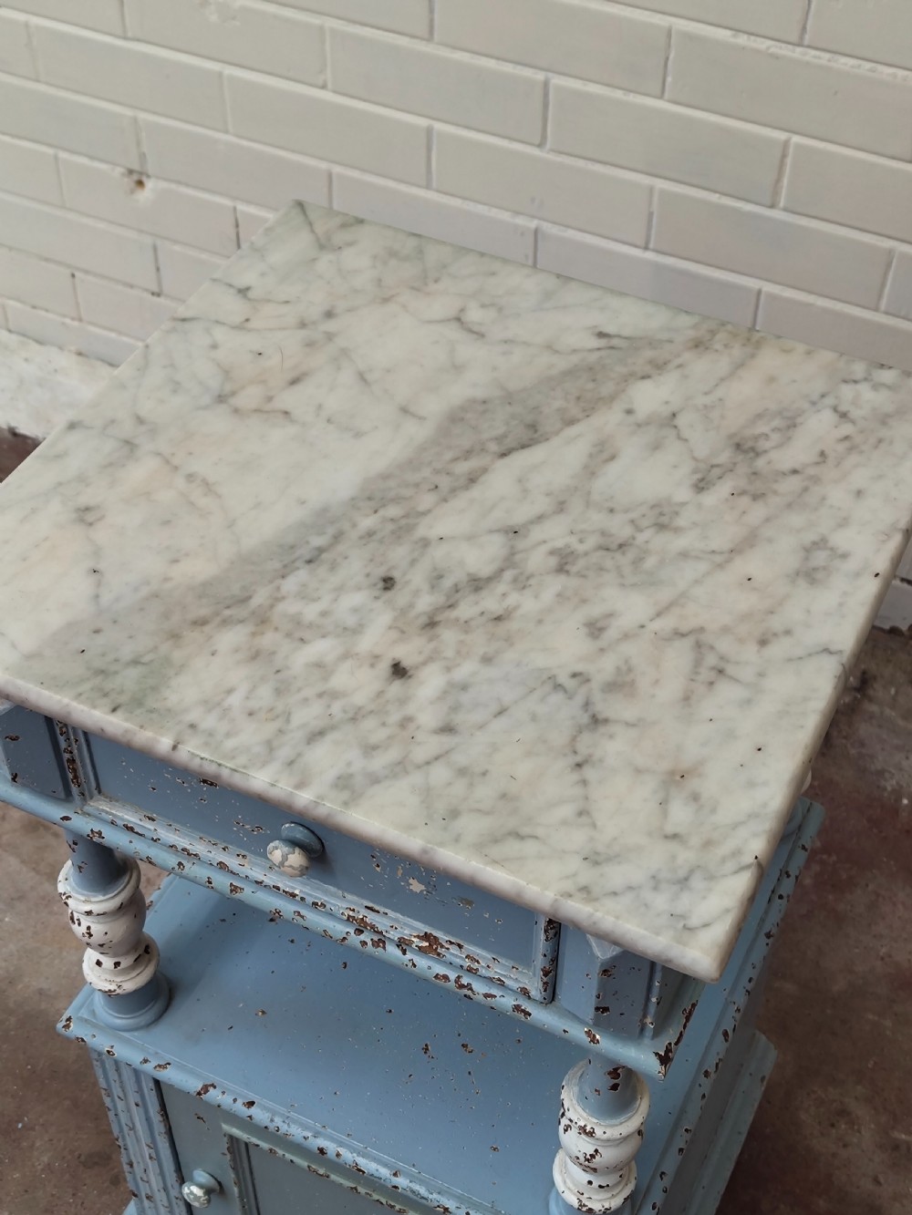 A pair of light blue painted French bedside tables featuring marble tops, single drawers, turned spindle columns, and bottom cupboards. View IX