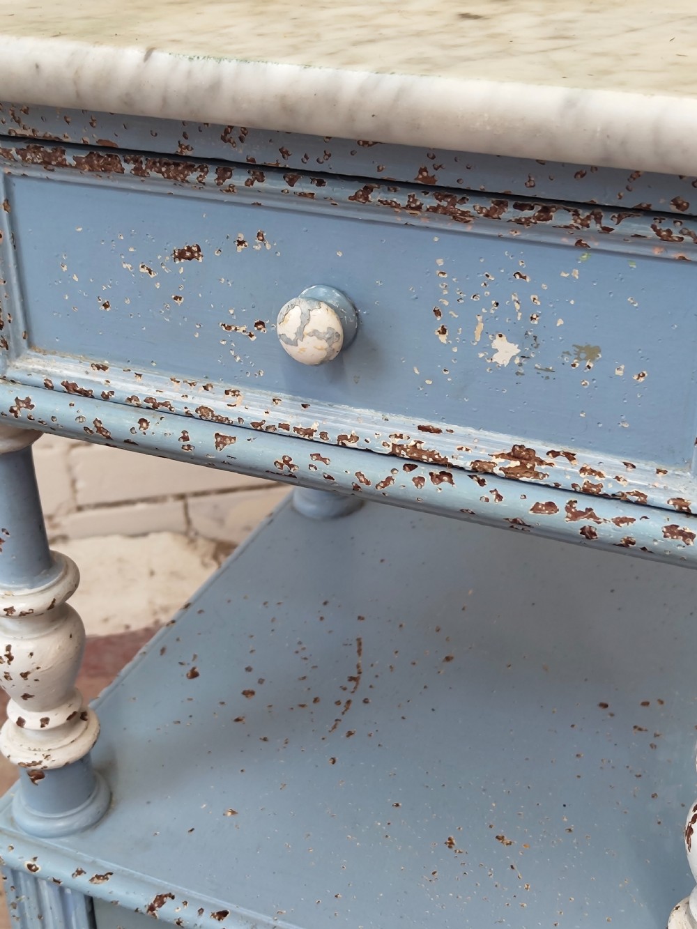 A pair of light blue painted French bedside tables featuring marble tops, single drawers, turned spindle columns, and bottom cupboards. View VII