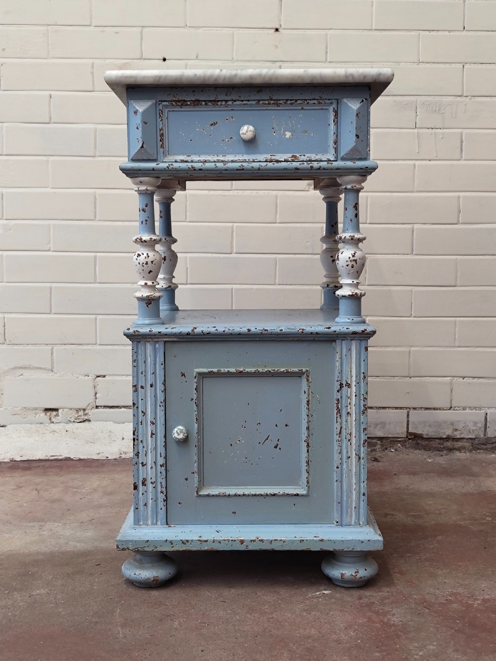 A pair of light blue painted French bedside tables featuring marble tops, single drawers, turned spindle columns, and bottom cupboards. View VIII