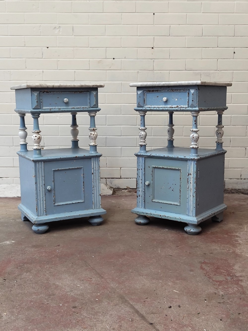 A pair of light blue painted French bedside tables featuring marble tops, single drawers, turned spindle columns, and bottom cupboards. View XI