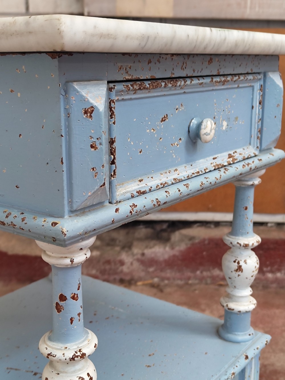 A pair of light blue painted French bedside tables featuring marble tops, single drawers, turned spindle columns, and bottom cupboards. View XIII