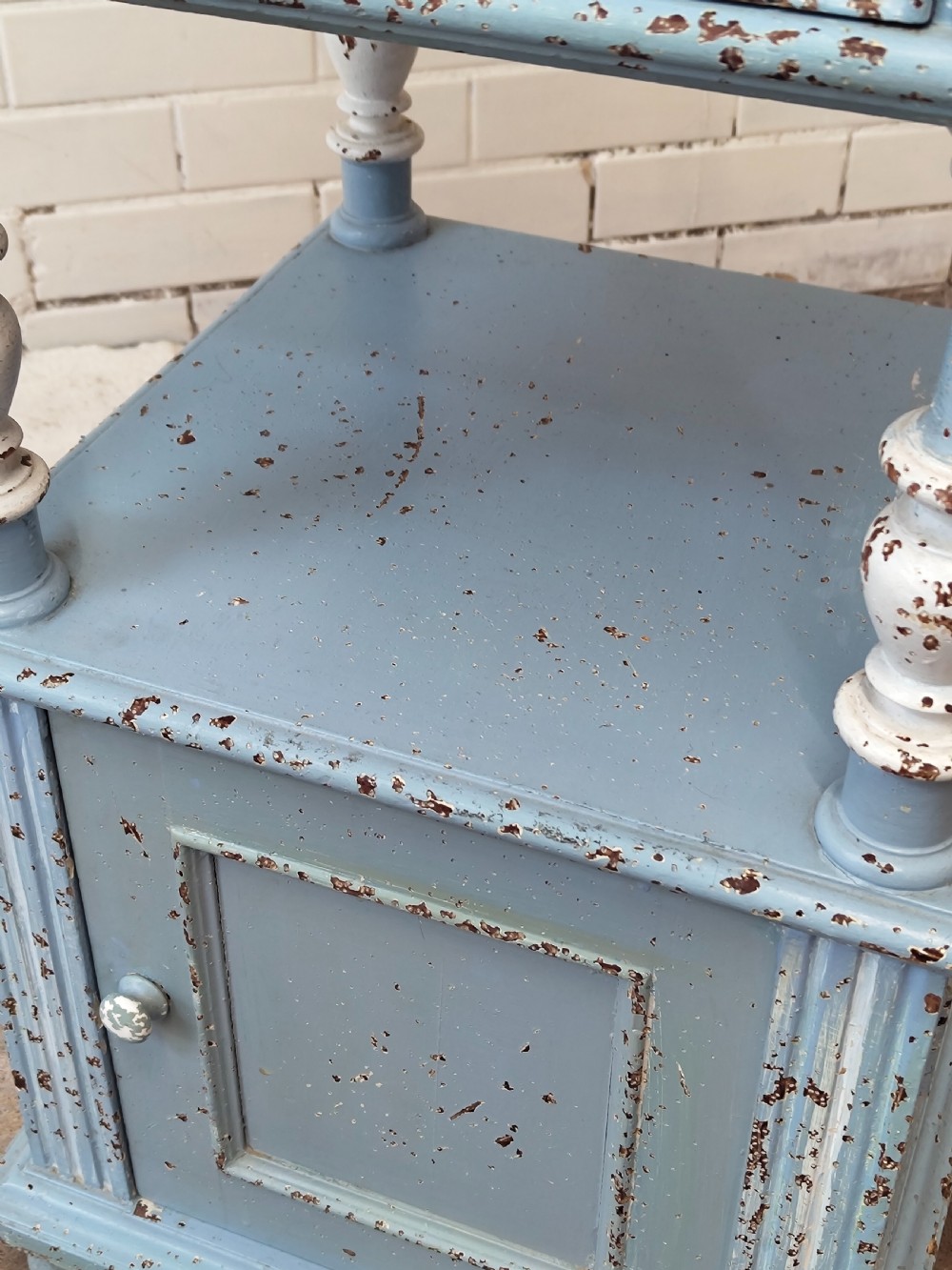 A pair of light blue painted French bedside tables featuring marble tops, single drawers, turned spindle columns, and bottom cupboards. View XX