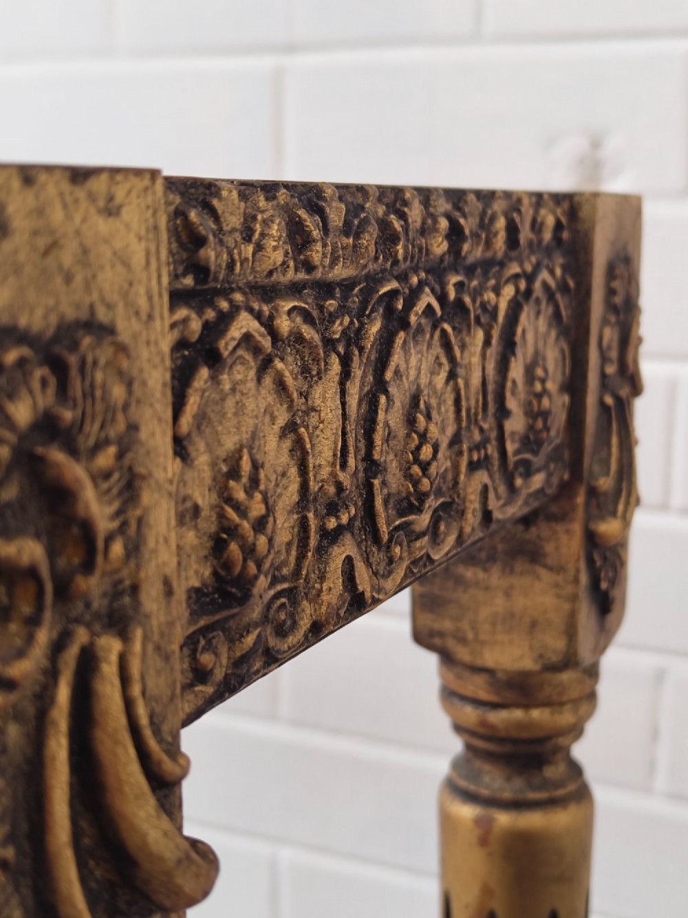 A diminutive French Louis XVI style giltwood console table with a red veined marble top, carved frieze, and slender tapered fluted legs. View X