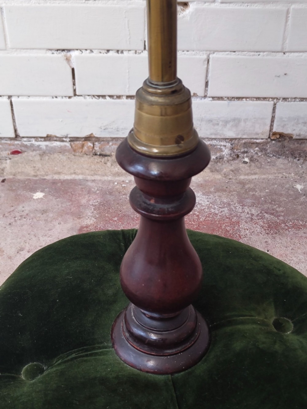 An antique Victorian brass pole screen featuring a green embroidered floral tapestry banner, fringed border, tassels, and a dark green velvet base. View III