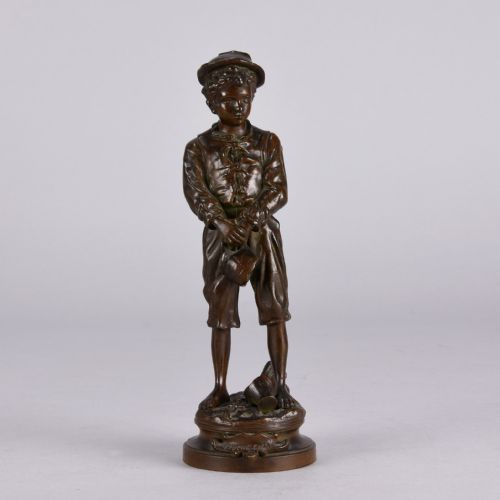 fig 1. A late 19th-century patinated bronze sculpture of a young boy wearing a cap and holding a broken jug, standing on a circular cast base.