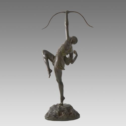 fig 4. A dark patinated bronze Art Deco sculpture depicting Diana the Huntress poised dynamically on a rocky base with a bow held overhead.
