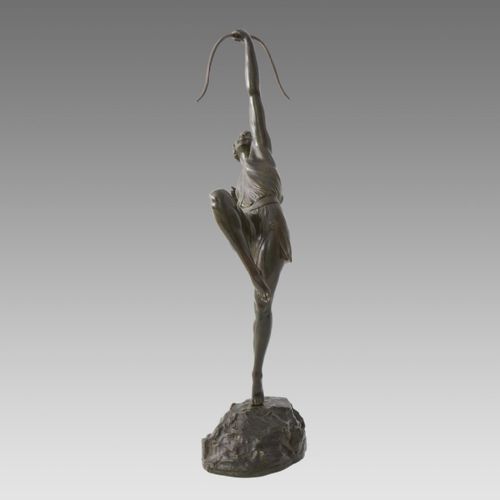 fig 5. A dark patinated bronze Art Deco sculpture depicting Diana the Huntress poised dynamically on a rocky base with a bow held overhead.