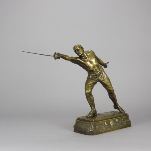 fig 2. A bronze sculpture depicting a shirtless male fencer in a lunge position with an extended blade, set upon a decorated bronze base.