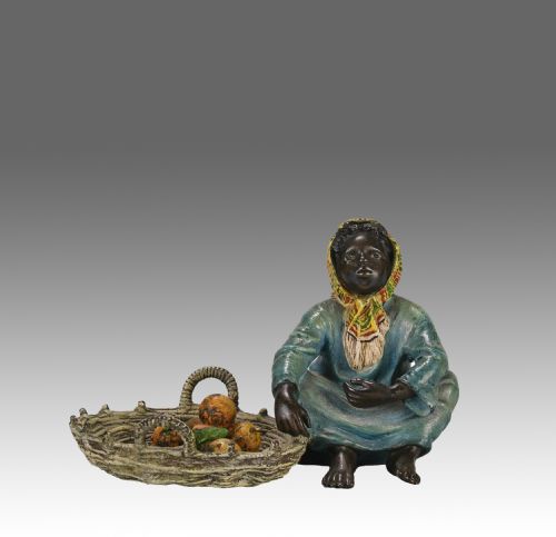 EARLY 20TH CENTURY COLDPAINTED BRONZE GIRL AND FRUIT BY FRANZ BERGMAN