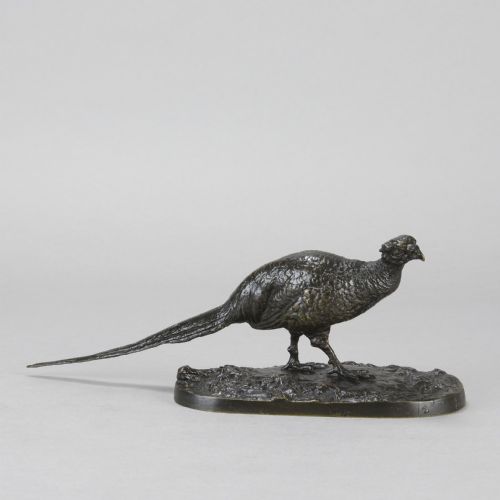 fig 1. A dark patinated bronze sculpture depicting a pheasant standing on an integral naturalist ground base.