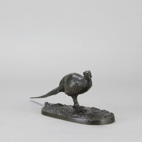 fig 2. A dark patinated bronze sculpture depicting a pheasant standing on an integral naturalist ground base.