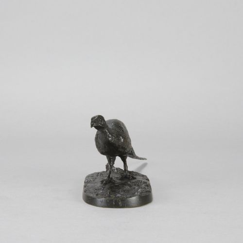 fig 3. A dark patinated bronze sculpture depicting a pheasant standing on an integral naturalist ground base.