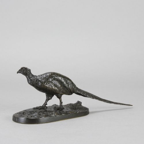 fig 4. A dark patinated bronze sculpture depicting a pheasant standing on an integral naturalist ground base.