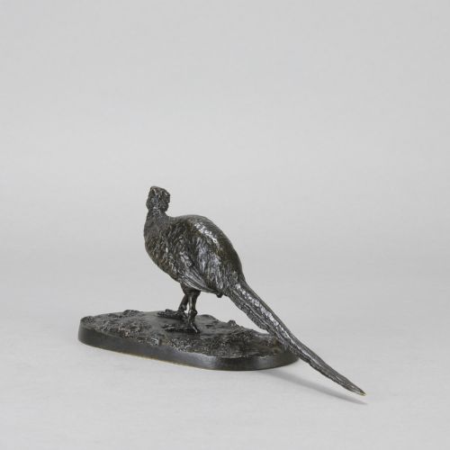 fig 6. A dark patinated bronze sculpture depicting a pheasant standing on an integral naturalist ground base.