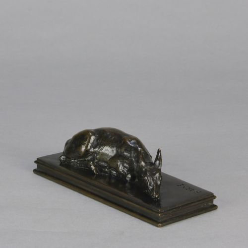 fig 2. A dark brown patinated bronze sculpture depicting a reclining doe resting on a rectangular bronze base signed Barye.