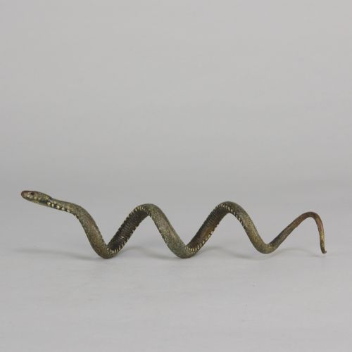 fig 1. An early 20th-century Viennese cold-painted bronze figure depicting a coiled snake with realistic scale detail.