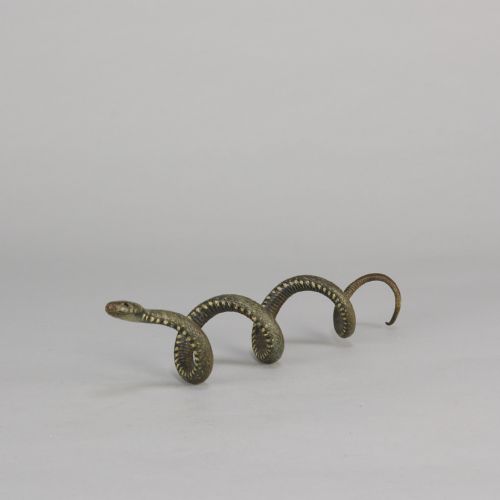 fig 3. An early 20th-century Viennese cold-painted bronze figure depicting a coiled snake with realistic scale detail.