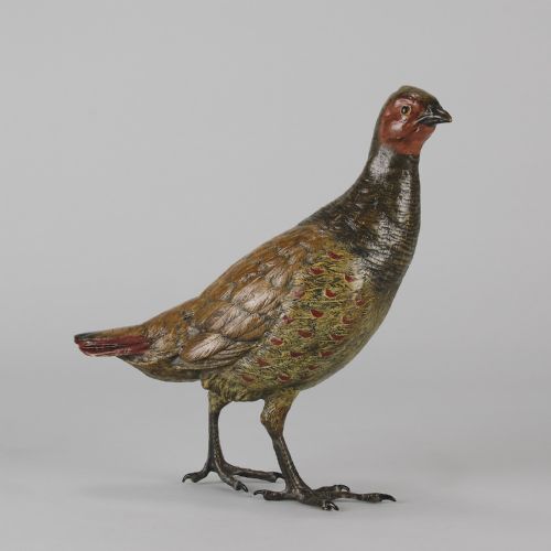 fig 1. A cold-painted bronze sculpture depicting a standing grouse bird with detailed feather texturing in brown, red, and green tones.