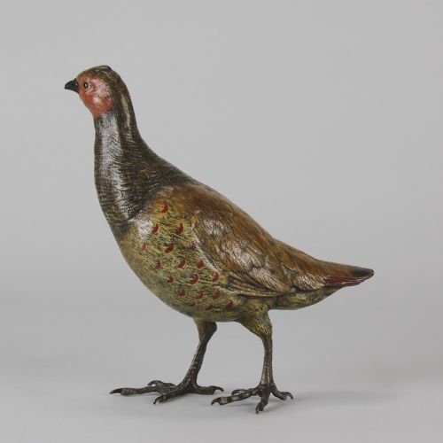 fig 5. A cold-painted bronze sculpture depicting a standing grouse bird with detailed feather texturing in brown, red, and green tones.