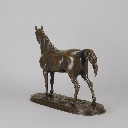 fig 6. A mid-nineteenth-century patinated bronze sculpture depicting an Arabian stallion standing on a naturalistic base.