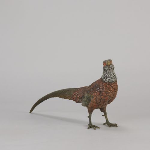 fig 2. An early 20th-century cold-painted bronze sculpture depicting a standing gamebird pheasant with detailed plumage in shades of reddish-brown, grey, and red.