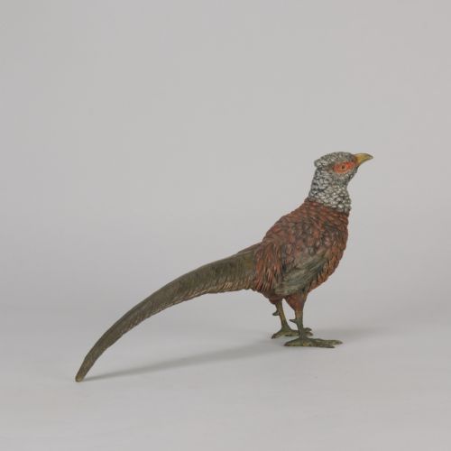 fig 3. An early 20th-century cold-painted bronze sculpture depicting a standing gamebird pheasant with detailed plumage in shades of reddish-brown, grey, and red.
