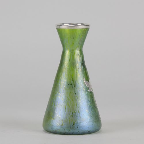 fig 4. A conical iridescent green and blue glass vase decorated with an intricate silver overlay floral design and a silver rim.