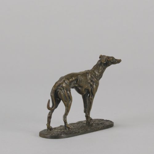 fig 1. A mid-19th-century French bronze sculpture depicting a standing greyhound with a dark patinated finish on an oval base.