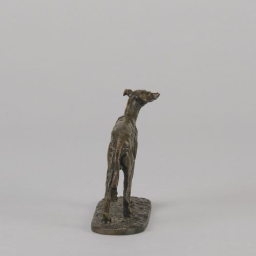 fig 5. A mid-19th-century French bronze sculpture depicting a standing greyhound with a dark patinated finish on an oval base.
