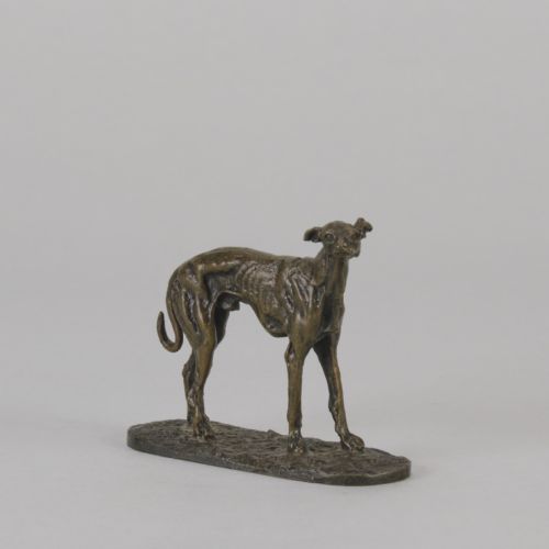 fig 7. A mid-19th-century French bronze sculpture depicting a standing greyhound with a dark patinated finish on an oval base.