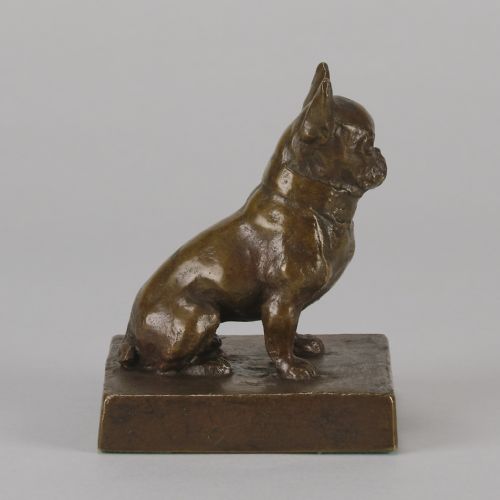 fig 1. A small patinated dark brown bronze sculpture of a seated French Bulldog positioned on a square metal plinth.