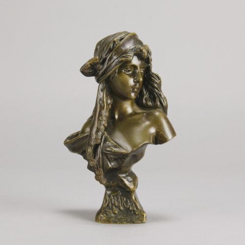 fig 1. A patinated bronze Art Nouveau bust depicting a young woman wearing a headscarf with draped coins, titled Miarka at the base.