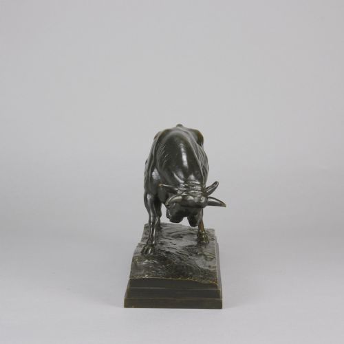 fig 3. A mid-19th-century dark patinated bronze sculpture of a standing bull with muscular details on an integral bronze base.